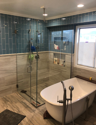 Compact bathroom makeover maximizing storage with a new vanity, shelves, and upgraded lighting.