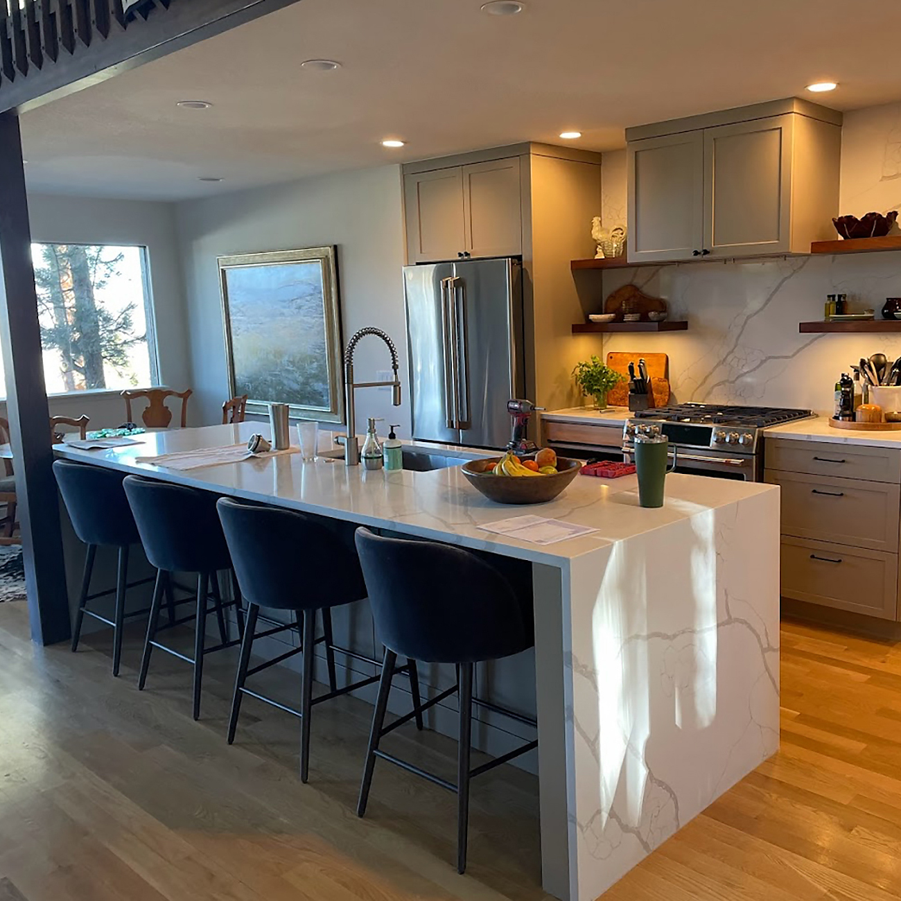 Updated kitchen remodel in a Denver, CO home with large island and modern lighting