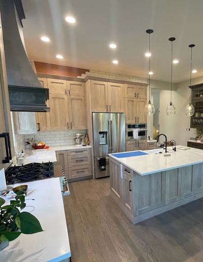 Kitchen remodel featuring painted cabinets, new hardware, and energy-efficient appliances.