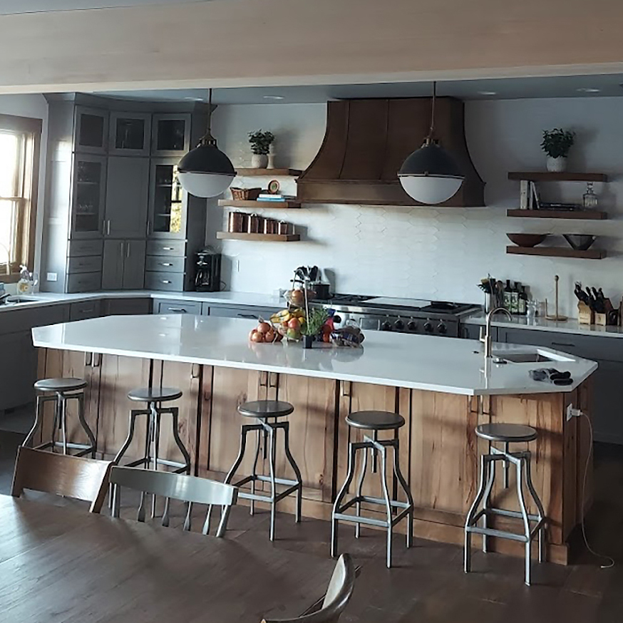 Kitchen remodel featuring painted cabinets, new hardware, and energy-efficient appliances.