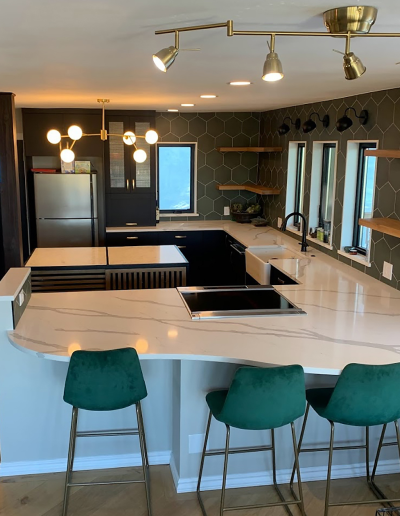 Small kitchen makeover maximizing storage with tall cabinets and corner solutions.