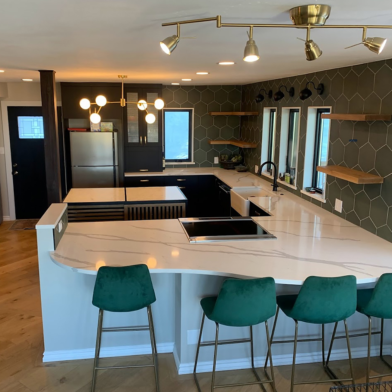 Kitchen remodel Broomfield County, CO featuring improved storage with deep drawers, pantry pullouts, and under-cabinet lighting.