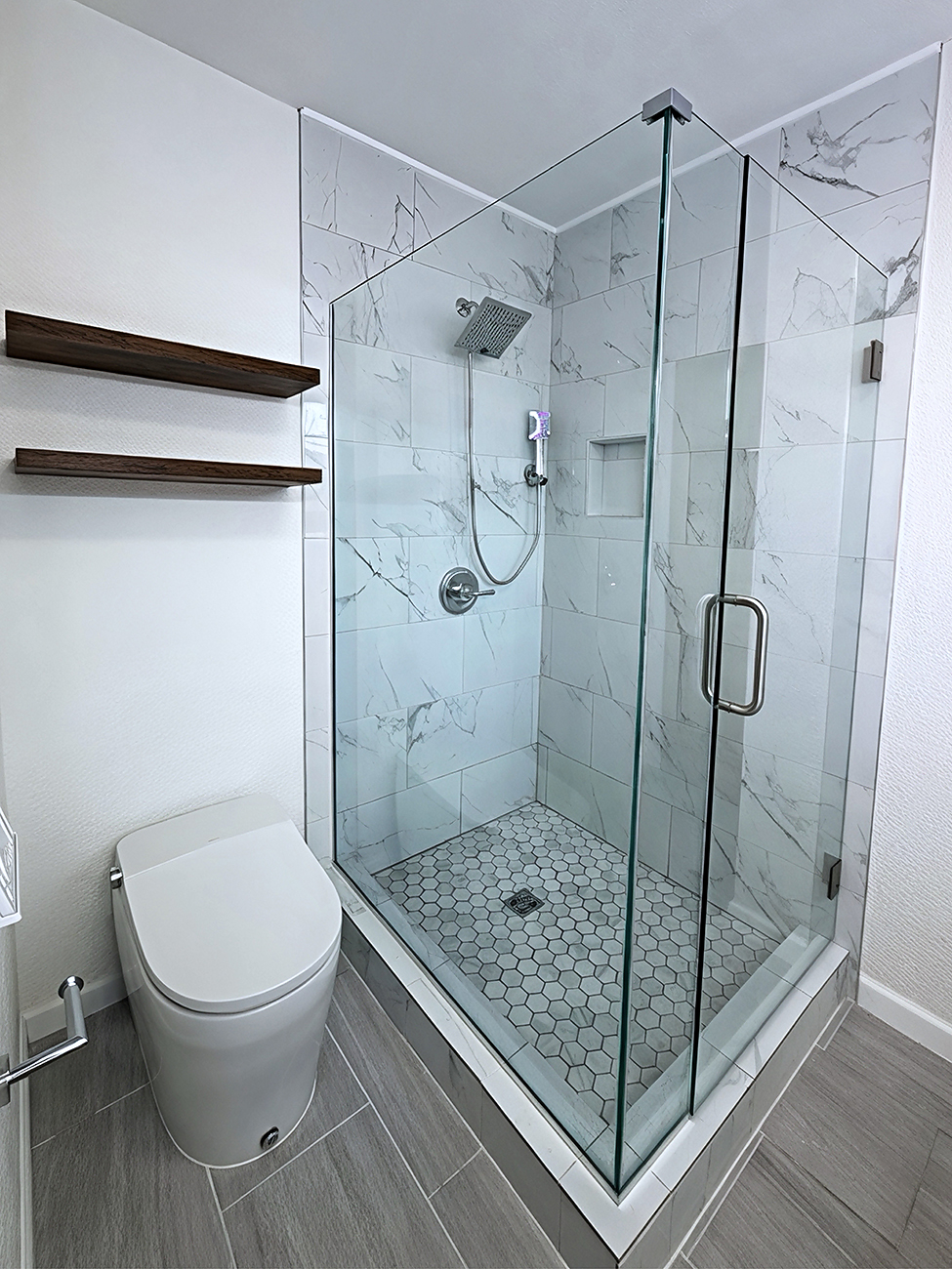 Bathroom remodel in Longmont CO with walk in shower, tile walls and new vanity