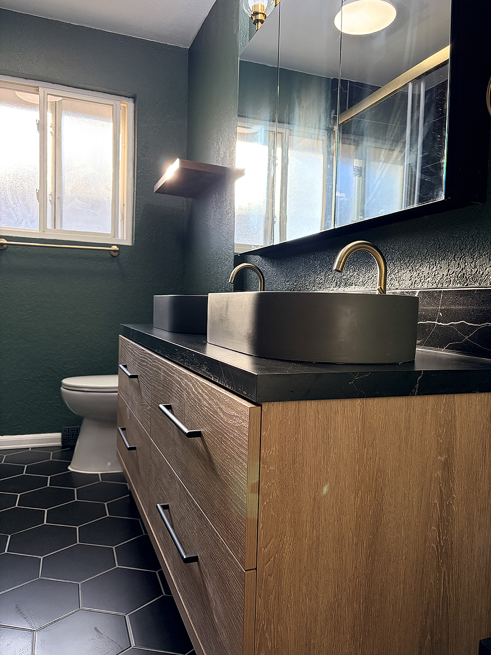 Denver Wash Park bathroom update with tiled tub surround and black fixtures